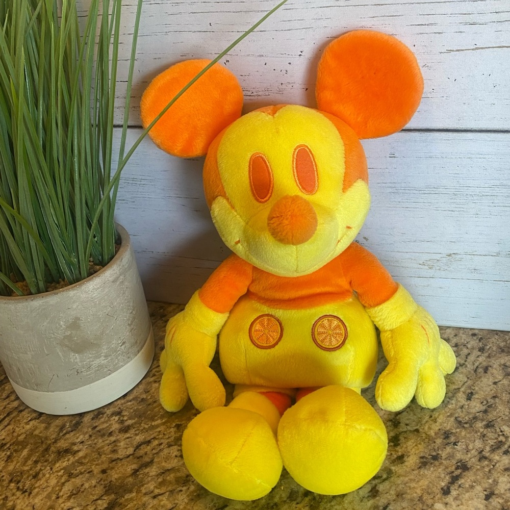 Limited edition orange and yellow scented Mickey.